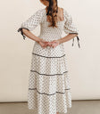 Polka dot dress styled in cream