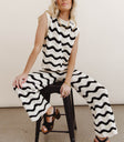 Pants in black paired with a striped black top