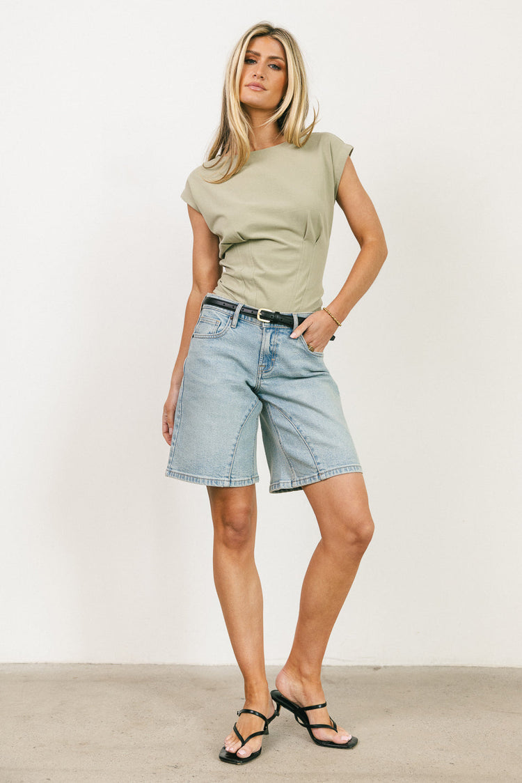 pleats on the hem of sage top