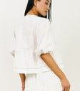 white blouse with black stitching