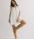 relaxed neckline on lavender mini dress