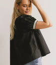 Short embroidered hem sleeves in black