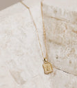 Cupid charm styled necklace in gold