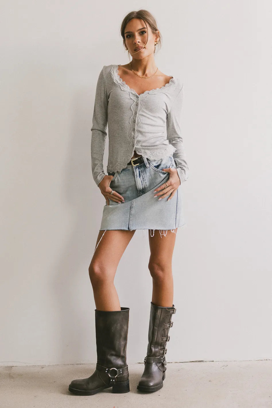 Top in grey paired with mini denim skirt