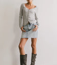 Top in grey paired with mini denim skirt
