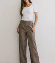 Top in white paired with a lavender pants